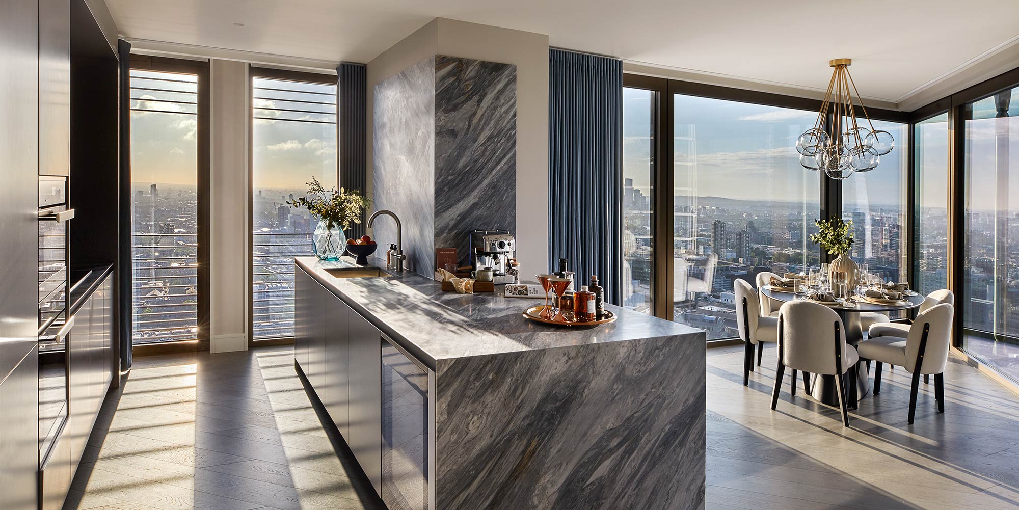  Open plan kitchen and dining area in three-bedroom apartments